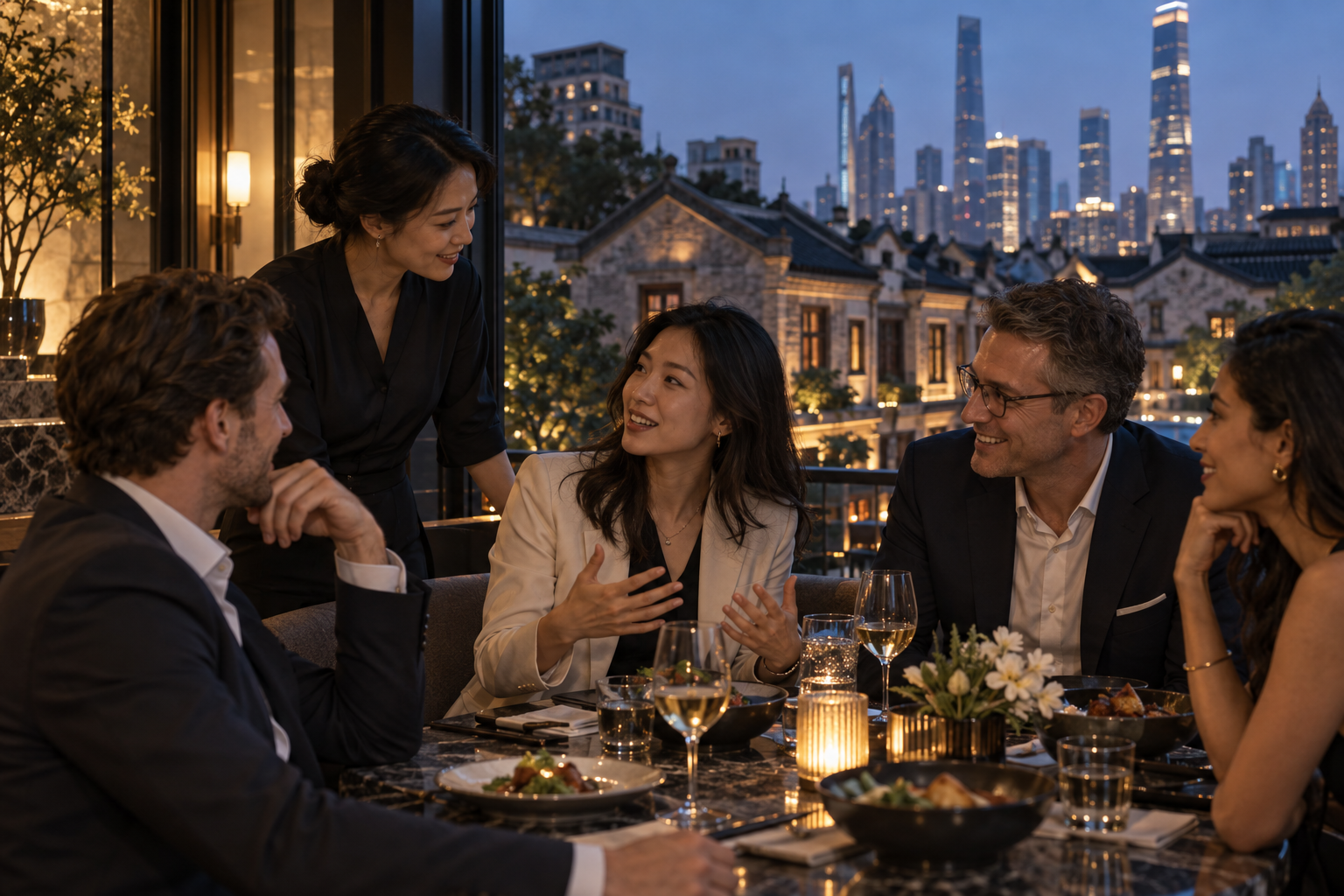 Professionals and a local host in conversation over an evening table in Jing’an